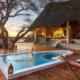 African safari accommodation guide featuring a luxury safari lodge overlooking the African savannah.