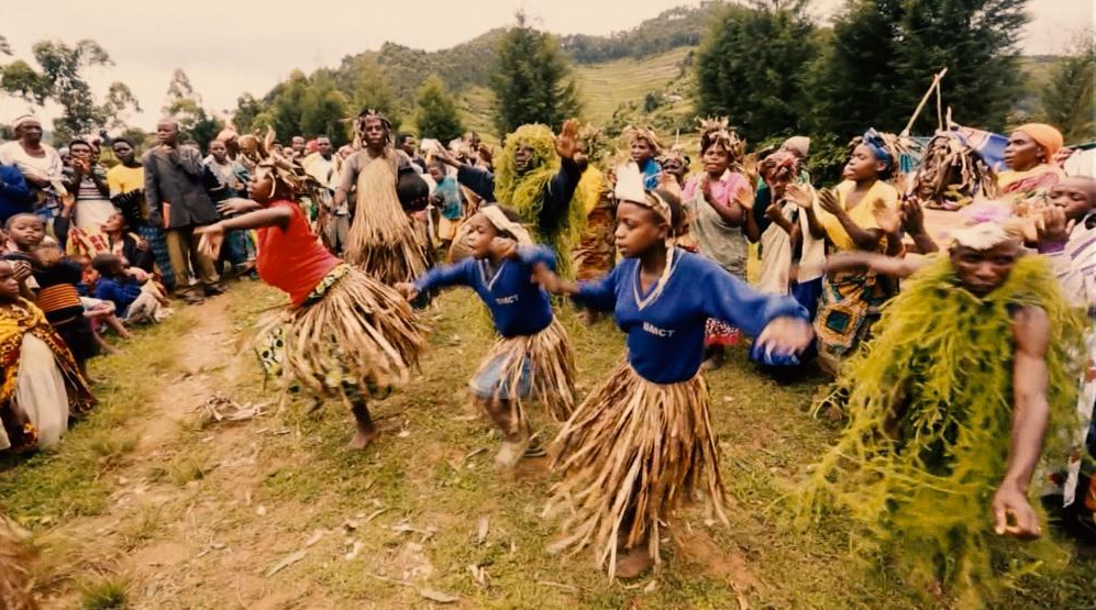 Visitors hiking through Bwindi Forest during a Uganda gorilla trekking safari